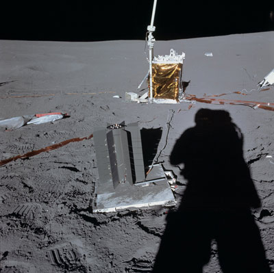 An Apollo 14 astronaut deploys the Apollo Lunar Surface Experiments Package's power source