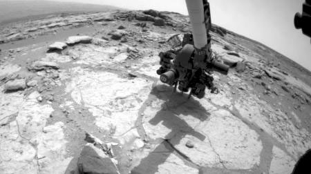 Curiosity rover's Front Hazard-Avoidance Camera shows the rover drilling into a rock target