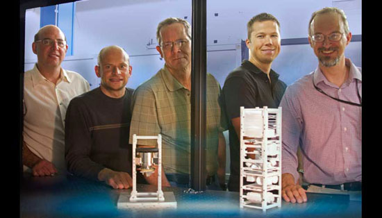 From left to right: Brian Bauman, Vincent Riot, Darrell Carter, Lance Simms and Wim De Vries have developed and tested land-based mini-satellites that eventually will be used in space to help control traffic in space