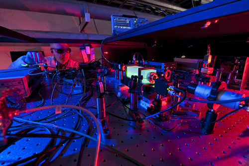 A Fermilab scientist works on the laser beams at the heart of the Holometer experiment