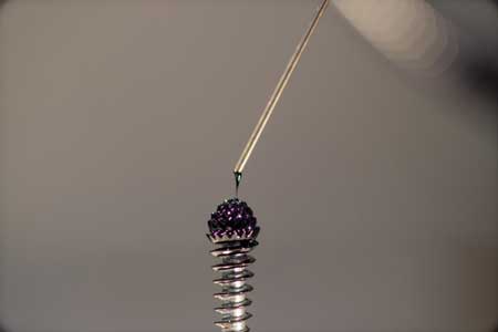 ferrofluidic spike emits a jet of ions