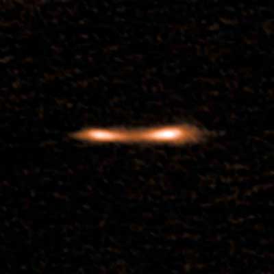 This ALMA image shows the Cosmic Eyelash, a remote starburst galaxy that appears double and brightened by gravitational lensing