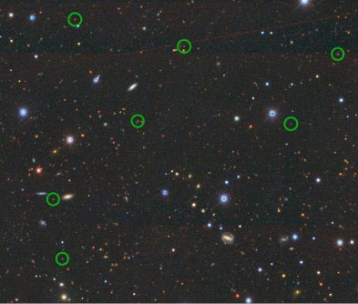 The image shows the location of some the emission line galaxies observed in the study (green circles) against the images of a big patch of the sky as observed by The Dark Energy Camera Legacy Survey