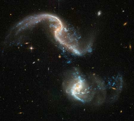 Arp 256 is a stunning system of two spiral galaxies, about 350 million light-years away