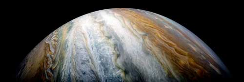 Jupiter's colorful stripes are cloud belts that extend thousand of kilometers deep