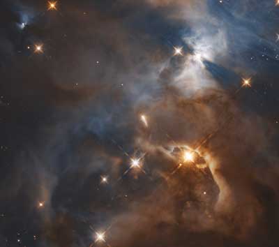 This image shows only the feature which was nicknamed the Bat Shadow. It is the shadow of a protoplanetary disc orbiting the star in the centre of the image
