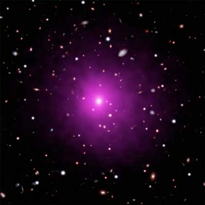 This image of Abell 2261 contains X-ray data from Chandra (pink) showing hot gas pervading the cluster as well as optical data from Hubble and the Subaru Telescope that show galaxies in the cluster and in the background