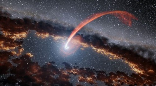 This illustration shows a glowing stream of material from a star, torn to shreds as it was being devoured by a supermassive black hole