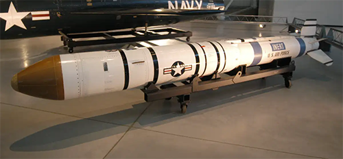 A long white and red missile on display