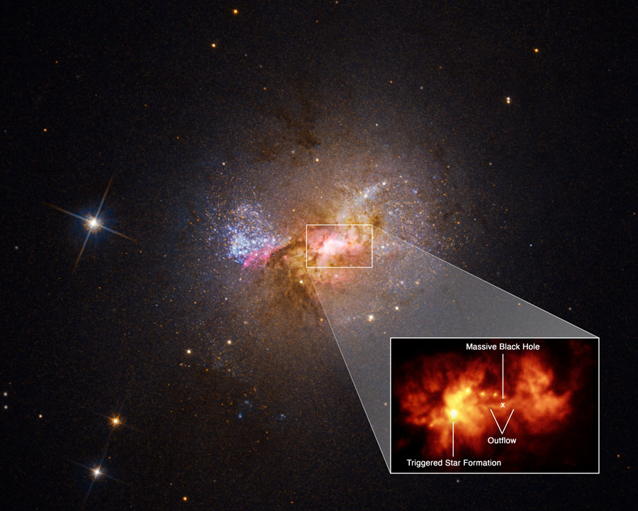 A pullout of the central region of dwarf starburst galaxy Henize 2-10 traces an outflow, or bridge of hot gas 230 light-years long