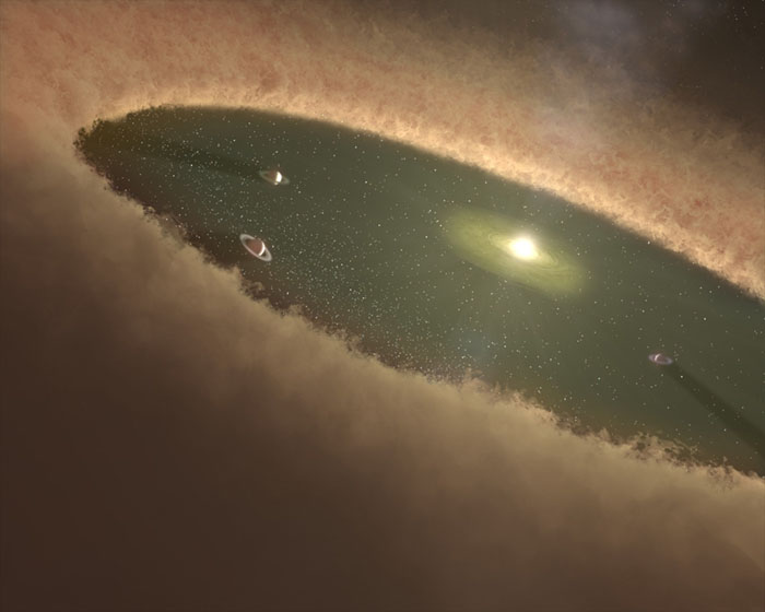 An artist’s rendering shows a hypothetical early solar system with a young star clearing a path in the gas and dust left over from its formation