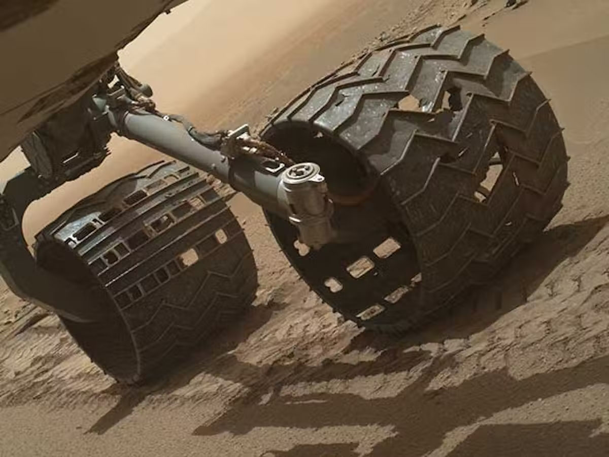 A photo of the wheels of Curiosity rover with holes visible