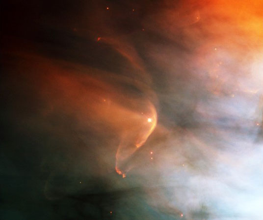 Infrared image of the shockwave (red arc) created by the massive giant star Zeta Ophiuchi in an interstellar dust cloud