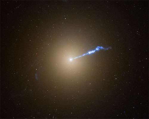 A Hubble Space Telescope image of the giant elliptical galaxy M87 with its blowtorch-like jet