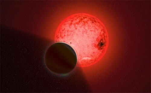 An artist’s conception of the gas giant planet TOI-5205 b orbiting a small, cool red dwarf star