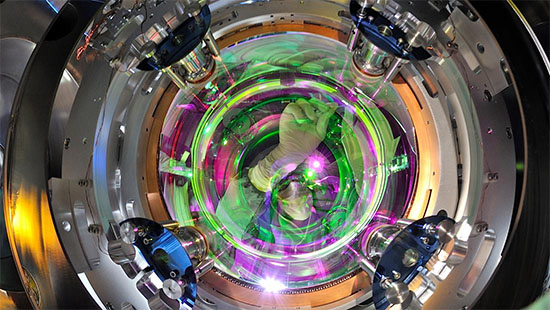 A researcher working on one of the Virgo detector's mirrors