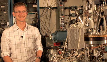 Sebastian Loth, next to a Scanning Tunneling Microscope