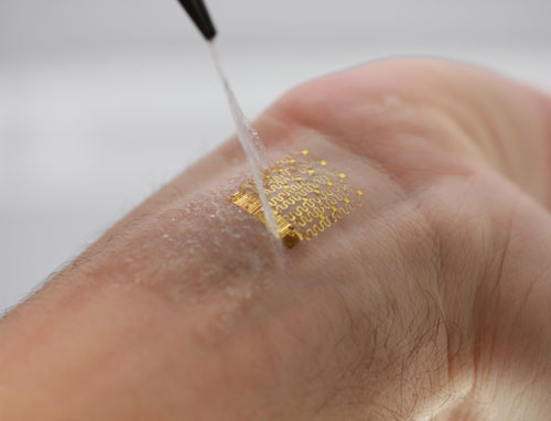 Ultrathin, compliant, skin-like arrays of precision temperature sensors