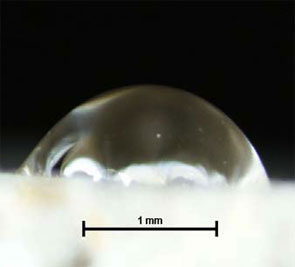 water droplet on an untreated biocalcareous stone