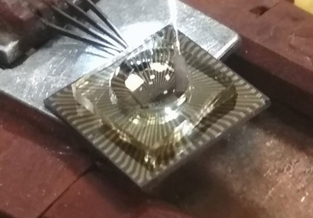 Image shows chip containing an array of graphene transistors in the set-up to toxins measurements