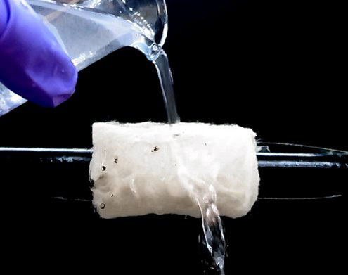 Washing out contaminates from a self-cleaning hydrophobic ceramic aerogel