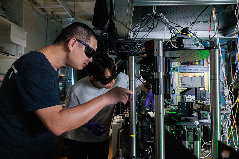 Dr Cai Hongbing with experimental setup in the lab